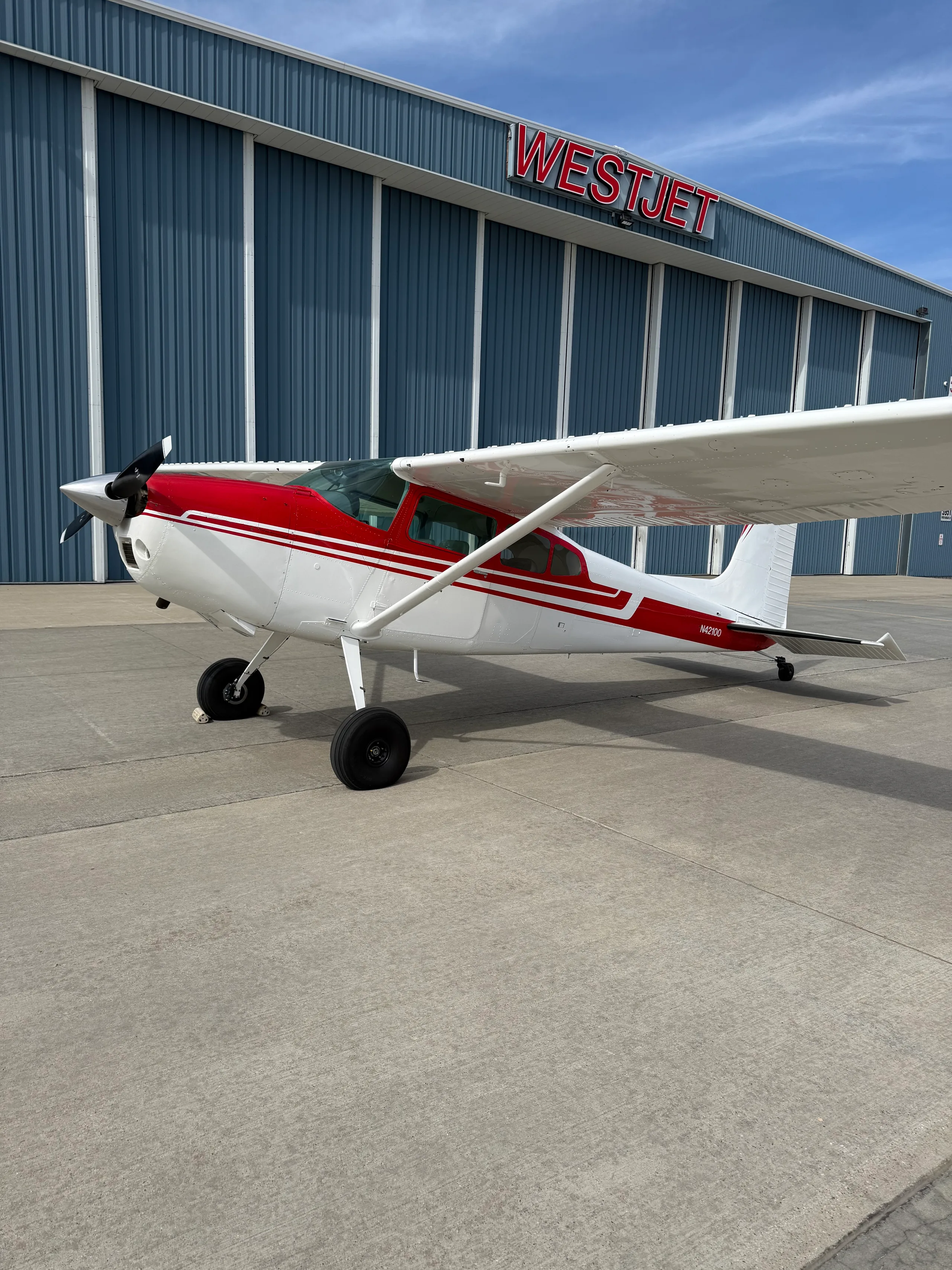 Exterior view of a 1973 Cessna 180J, N42100.