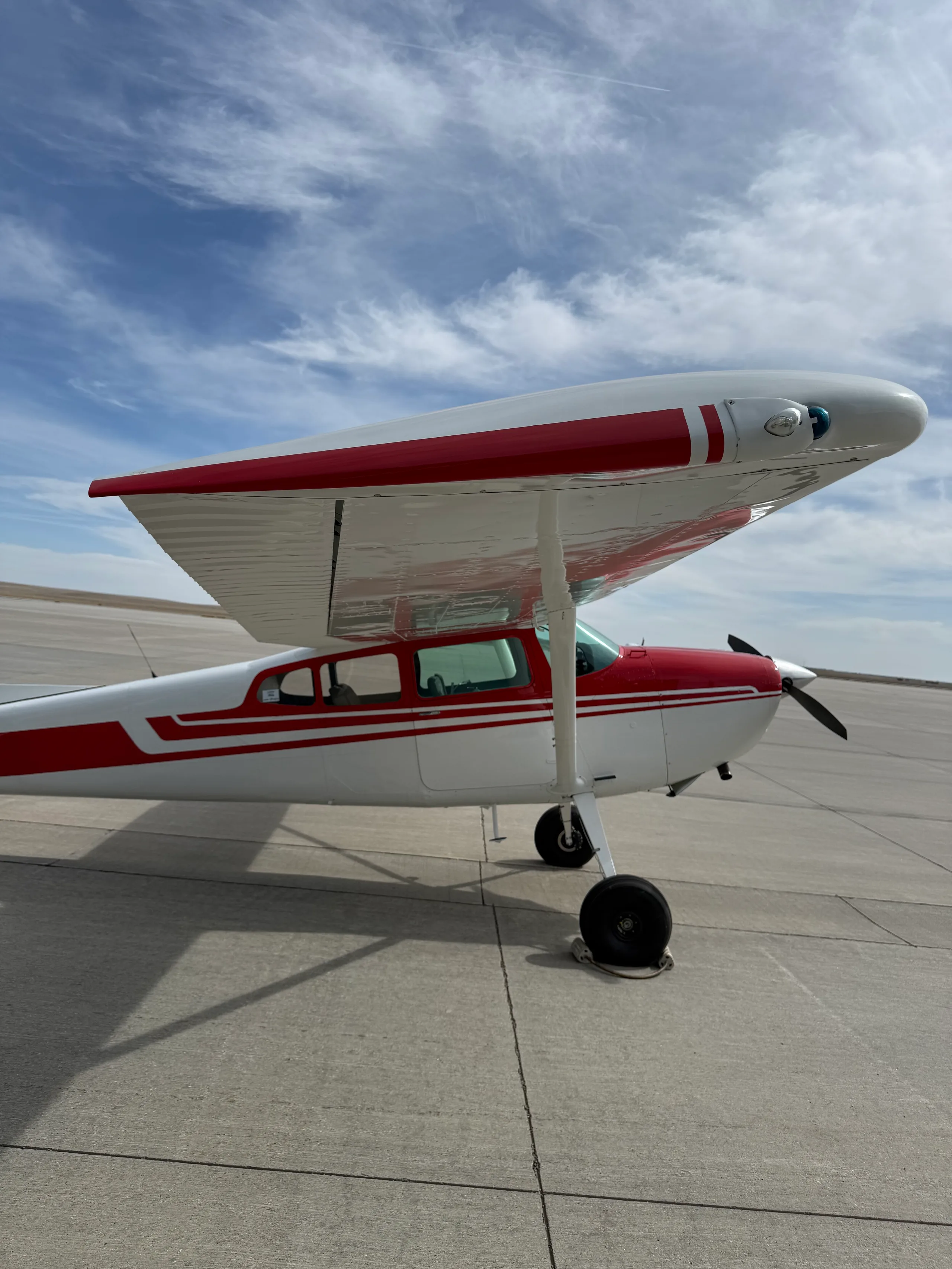 Exterior view of a 1973 Cessna 180J, N42100.