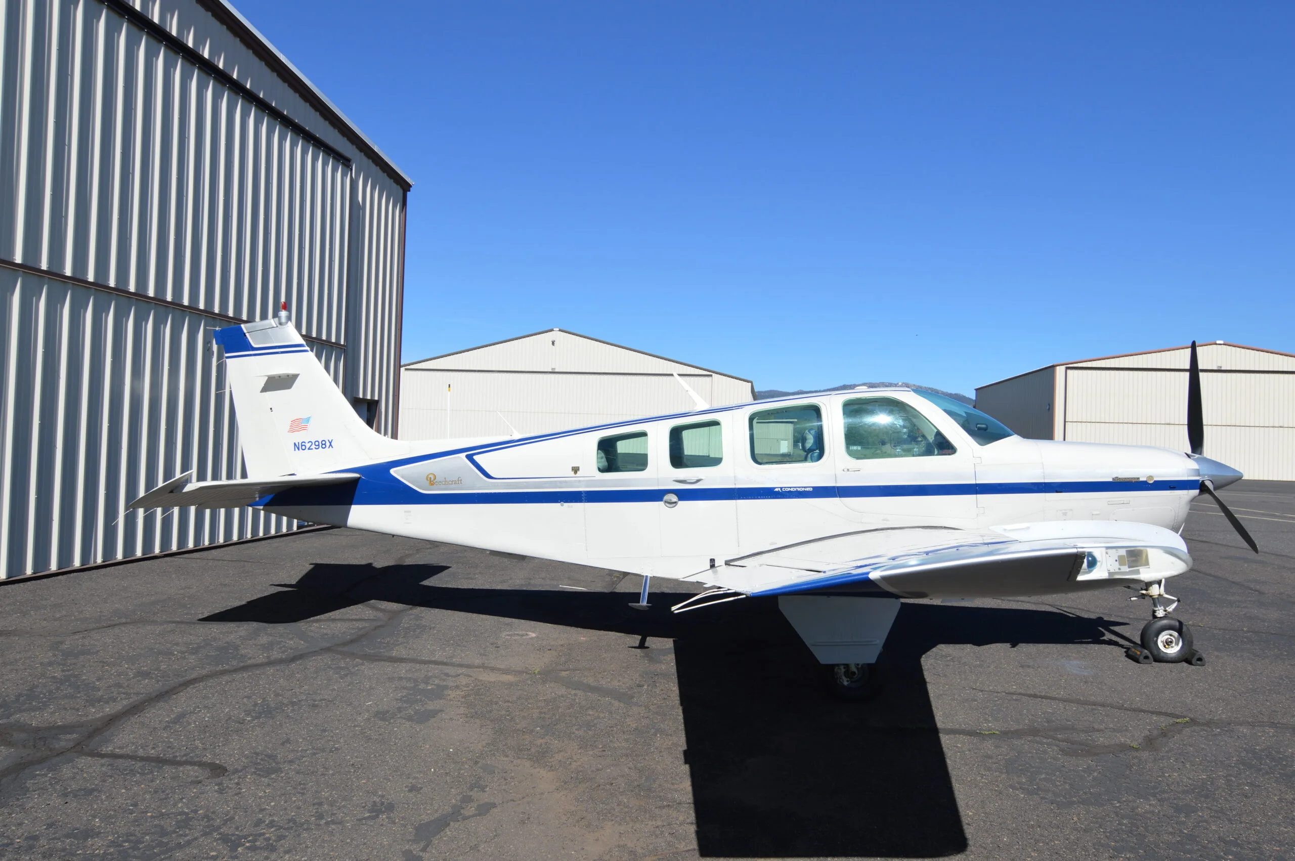 Exterior view of a 1982 Beechcraft A36 (Beech Aircraft 50th Anniversary Model), N6298X.