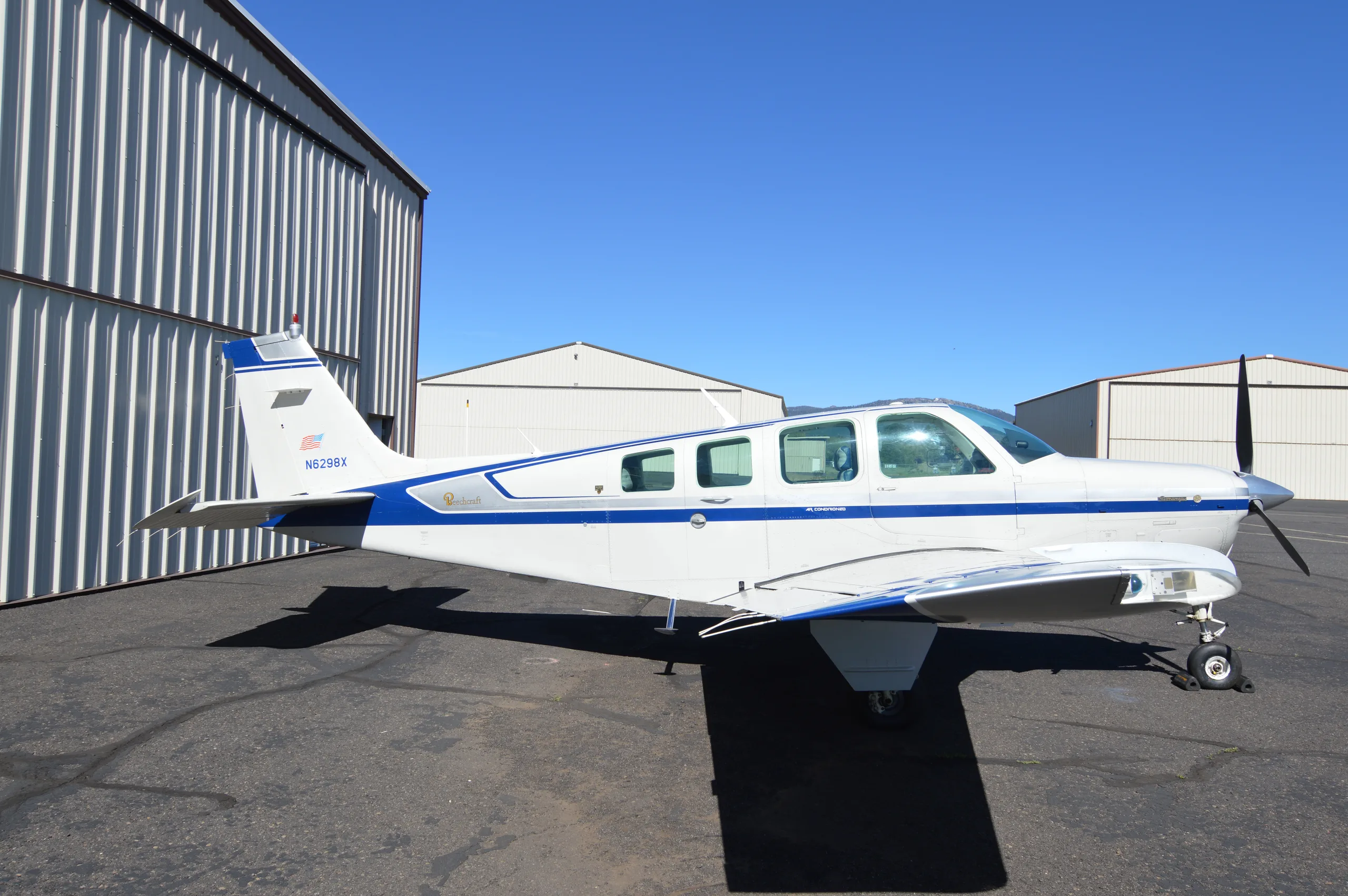 Exterior view of a 1982 Beechcraft A36 (Beech Aircraft 50th Anniversary Model), N6298X.