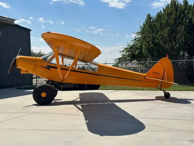 Exterior view of a 1979 Piper PA-18-150, N9166T.