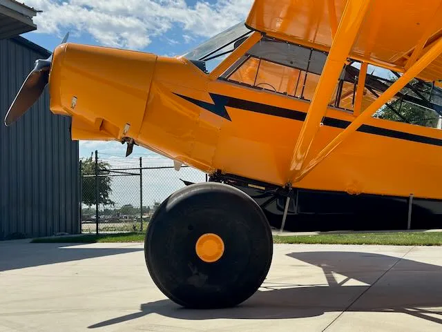 Exterior view of a 1979 Piper PA-18-150, N9166T.