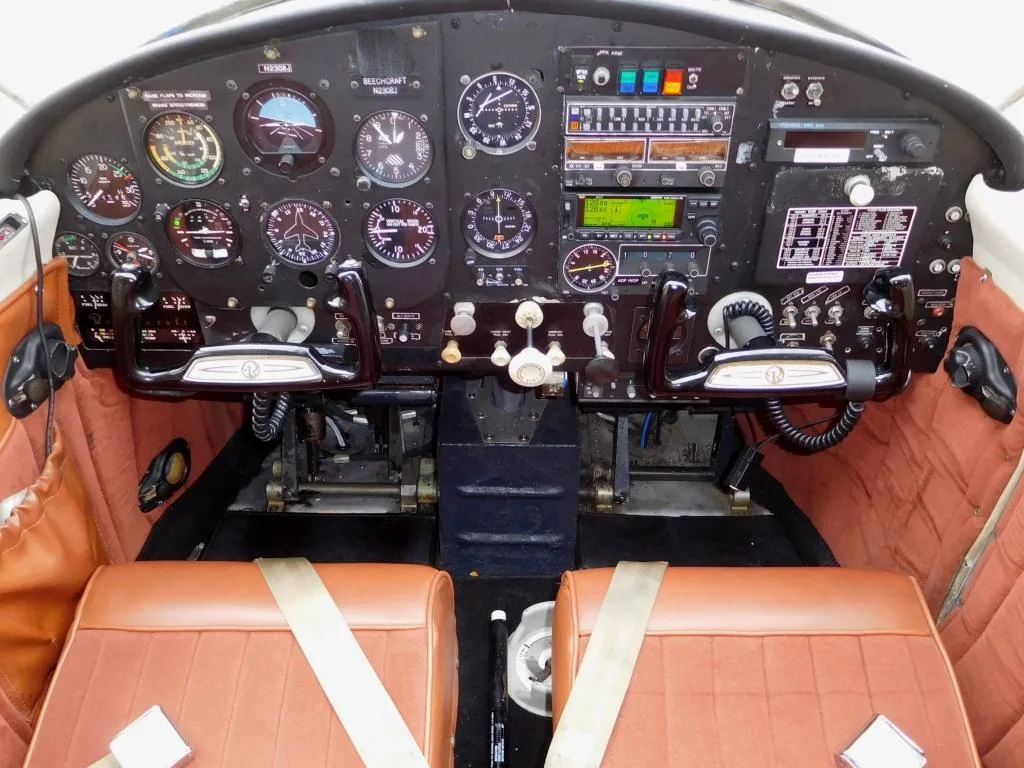 Cockpit and instrument panel of a 1963 Beech Musketeer - N2308J Aircraft.