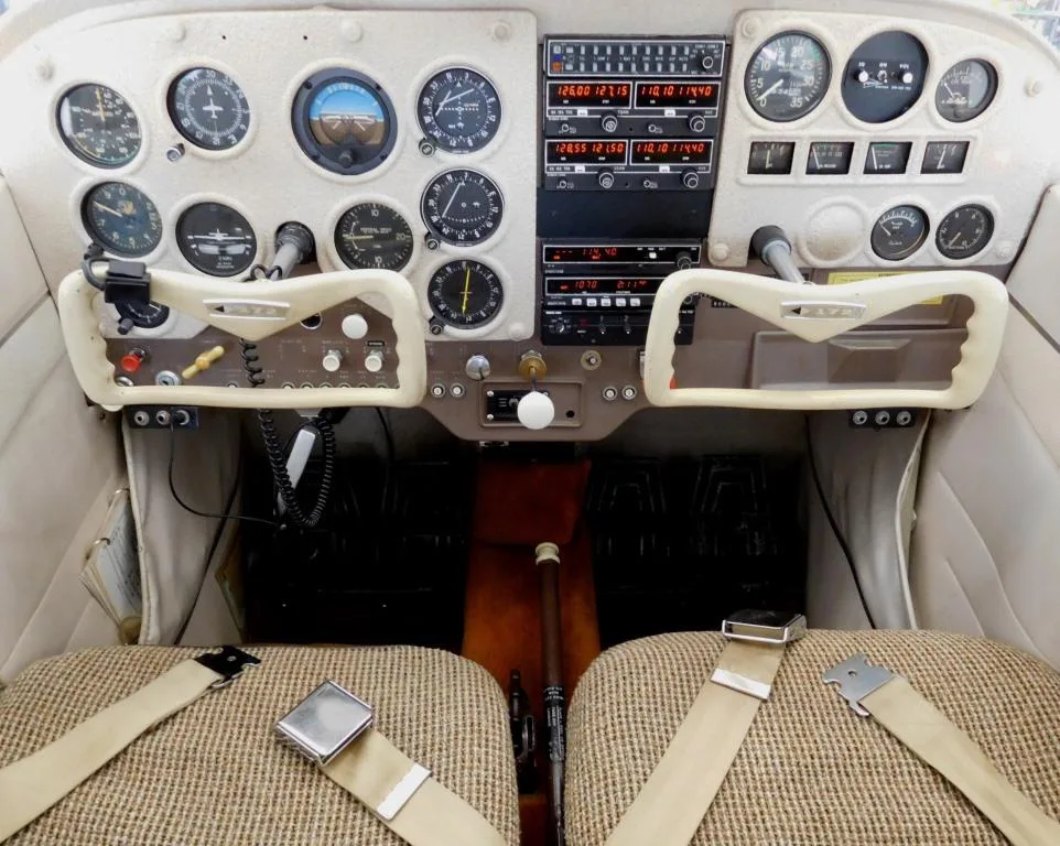 Cockpit and instrument panel of a 1964 Cessna 172 - N7714U Aircraft.
