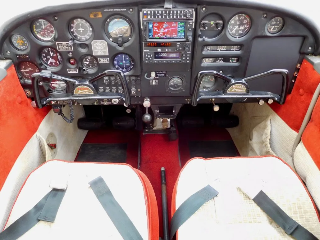 Cockpit and instrument panel of a 1964 Piper Cherokee 180 - N7660W Aircraft.