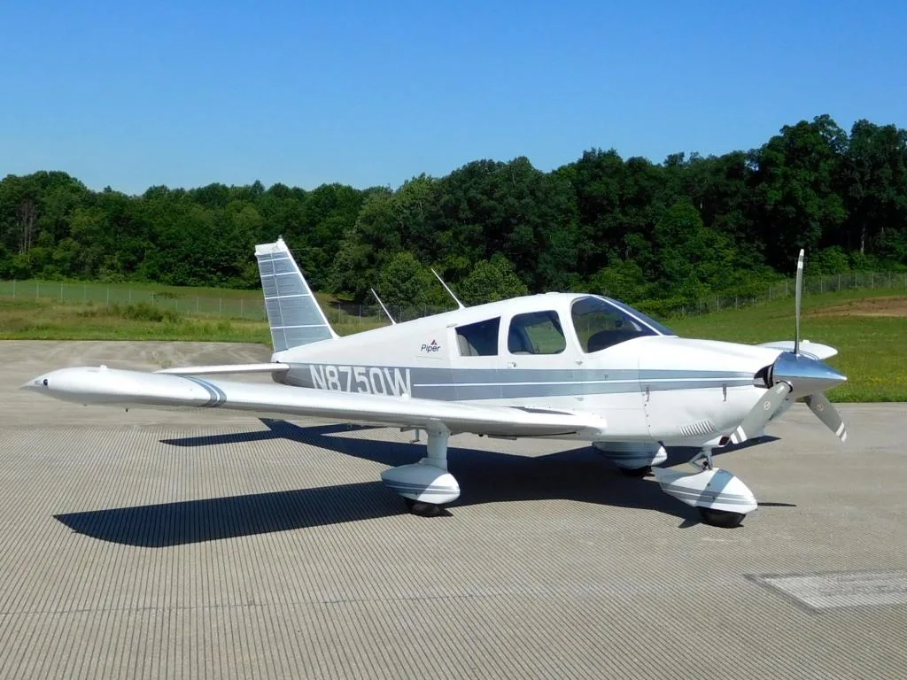 Exterior view of a 1964 Piper Cherokee 235 - N8750W Aircraft.