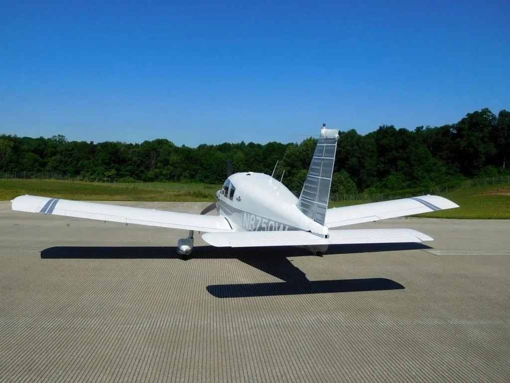 Exterior view of a 1964 Piper Cherokee 235 - N8750W Aircraft.