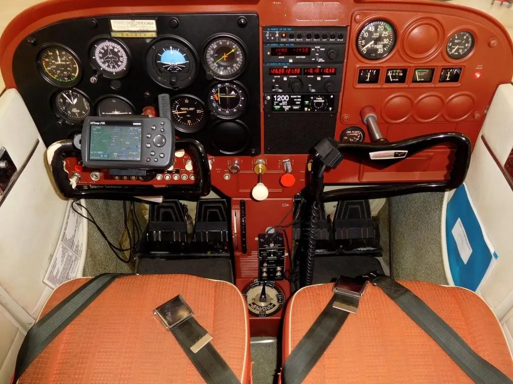 Cockpit and instrument panel of a 1965 Cessna 172 - N8181U Aircraft.