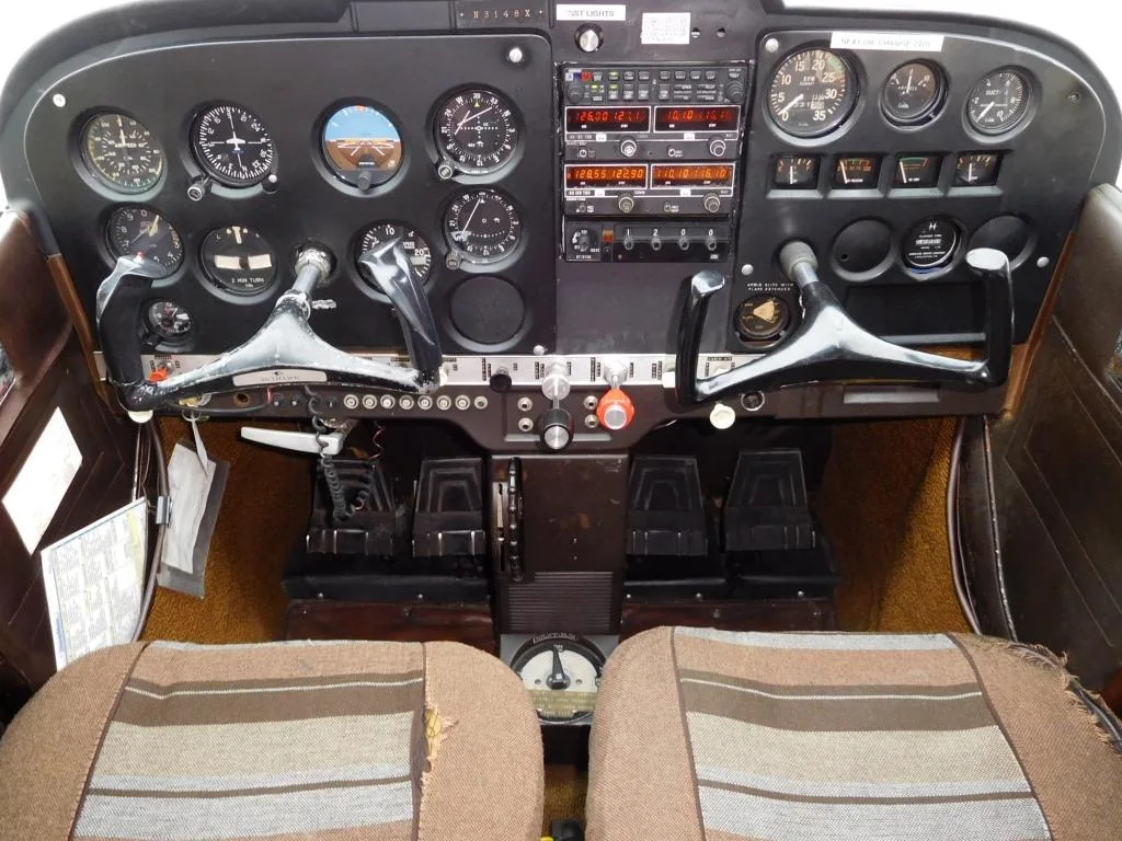 Cockpit and instrument panel of a 1967 Cessna 172 - N3148X Aircraft.