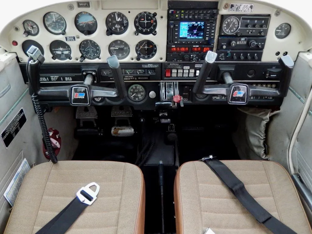 Cockpit and instrument panel of a 1971 Piper Cherokee 140- N418FL Aircraft.