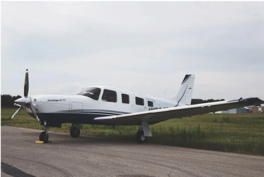 Exterior view of a 2006 Piper Turbo Saratoga II TC, N1084S.