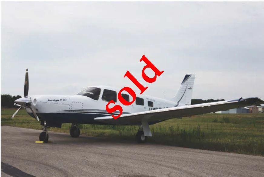 Exterior view of a 2006 Piper Turbo Saratoga II TC, N1084S.