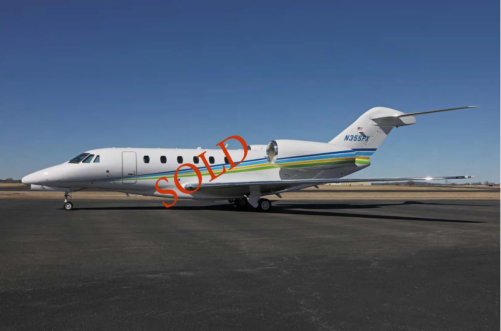 Exterior view of a 2012 Bombardier Challenger 605, N207R.