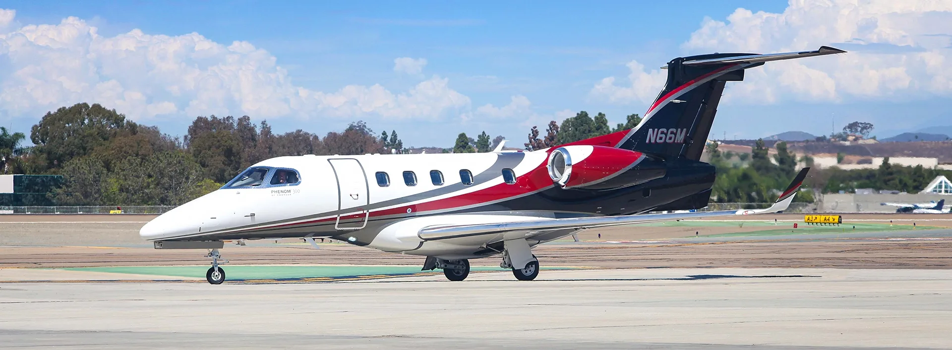 Exterior view of a 2017 Embraer Phenom 300.