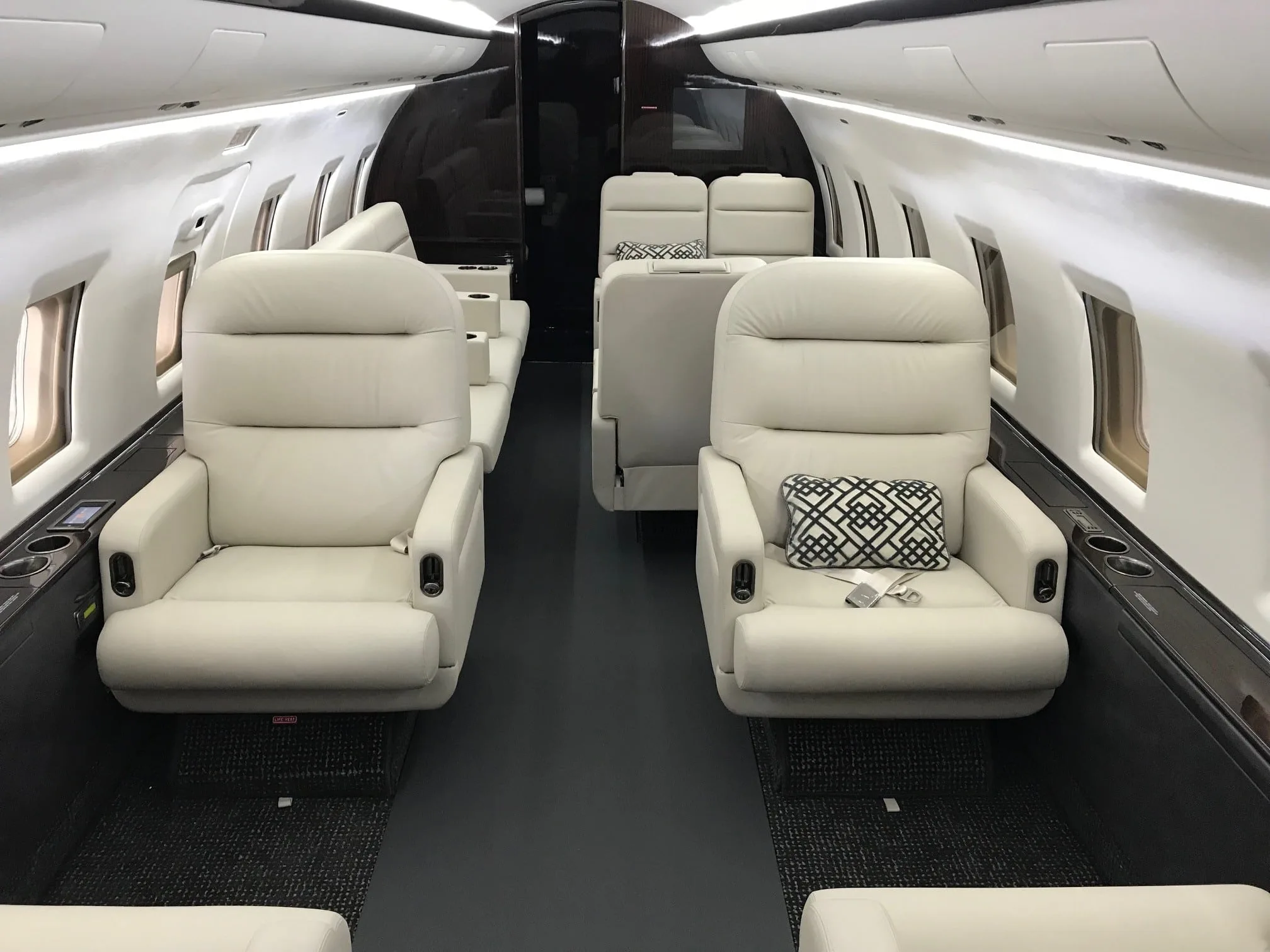 Cabin interior of a 2000 Bombardier Challenger 604 | Leviate Air Group.