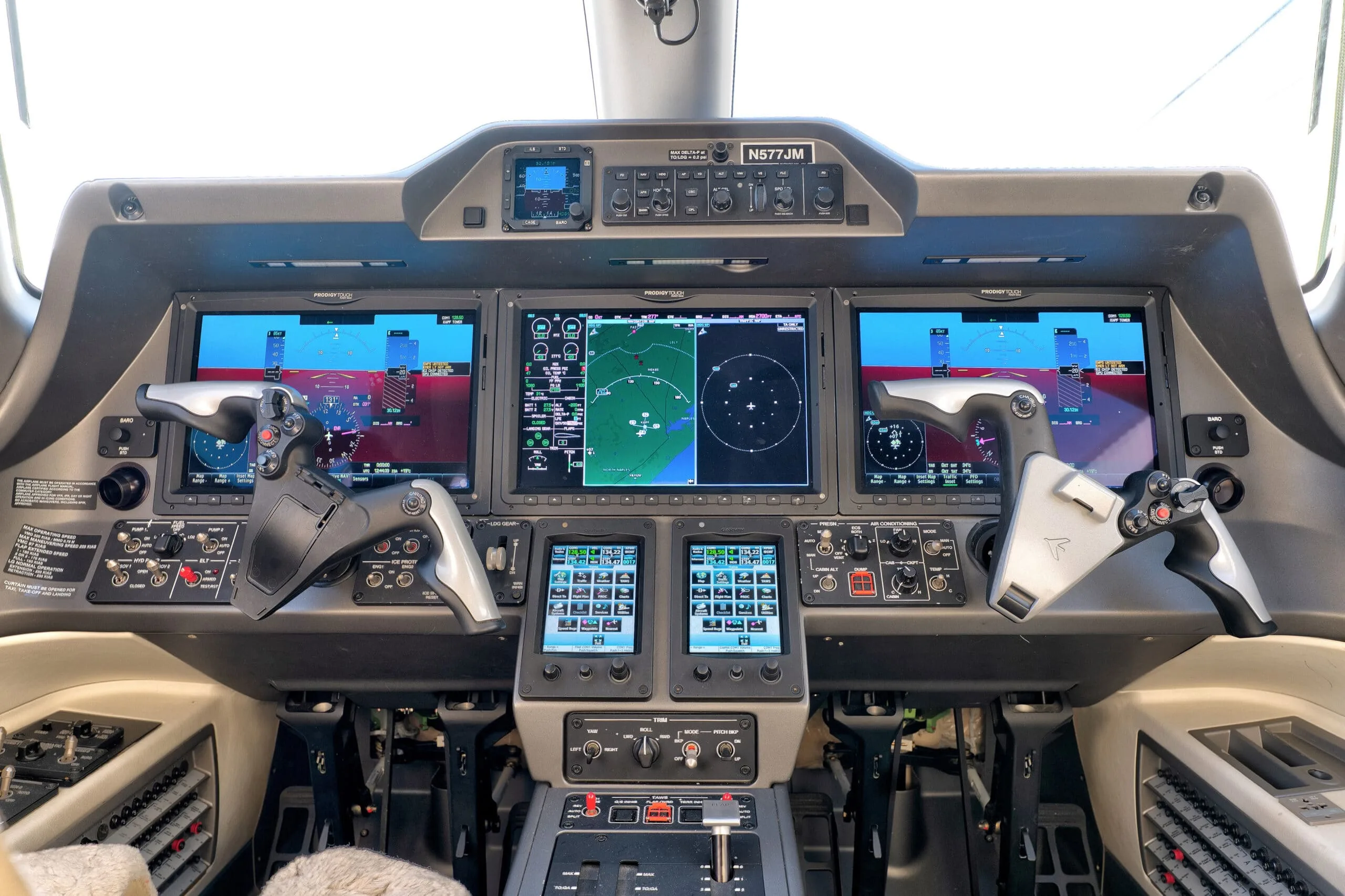 Cockpit and instrument panel of a 2015 Embraer PHENOM 300 | Leviate Air Group.