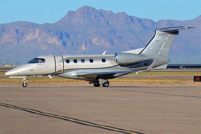 Exterior view of a 2015 Embraer PHENOM 300 | Leviate Air Group.