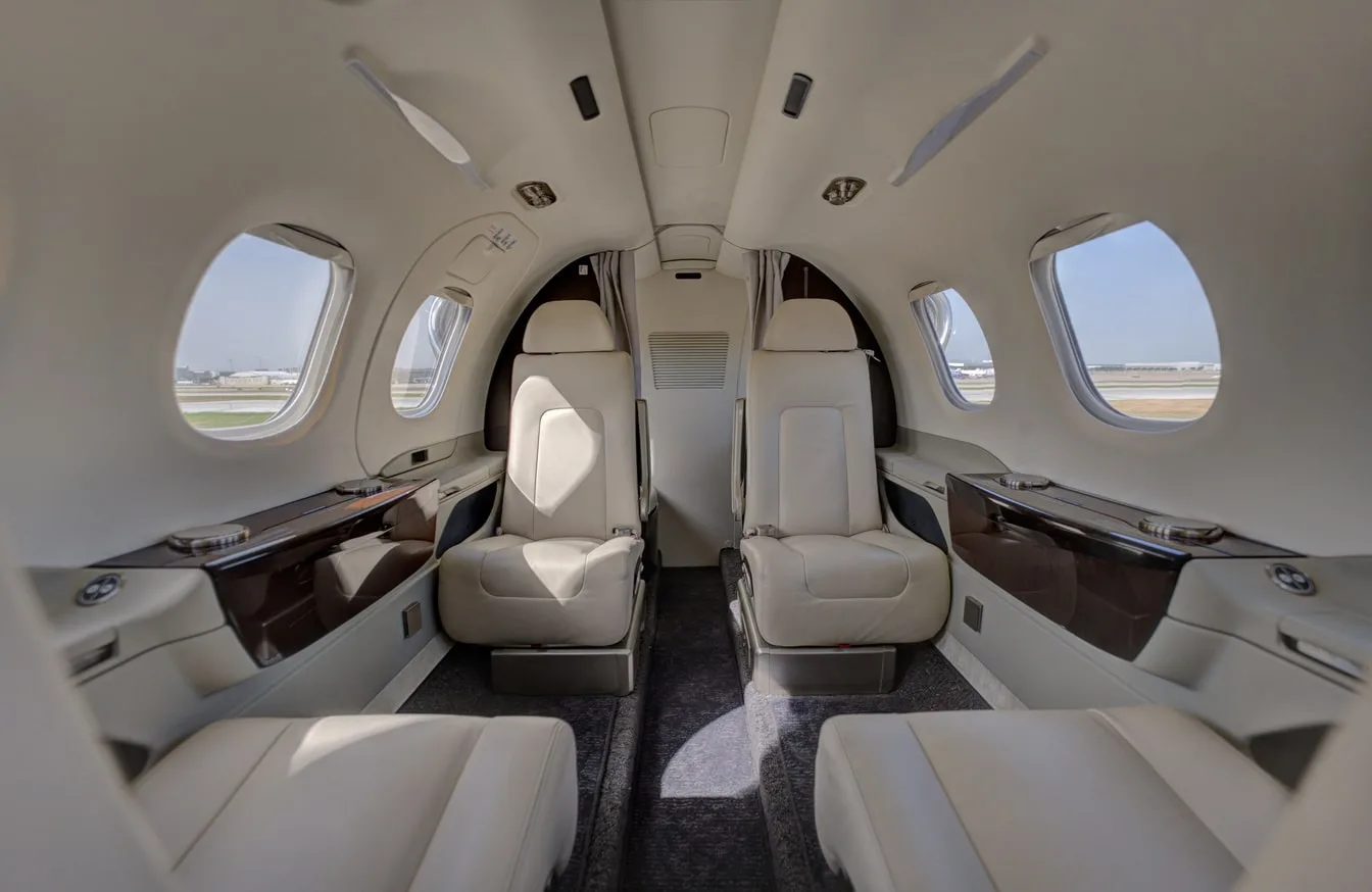 Cabin interior of a 2023 Embraer PHENOM 100EV | Leviate Air Group.