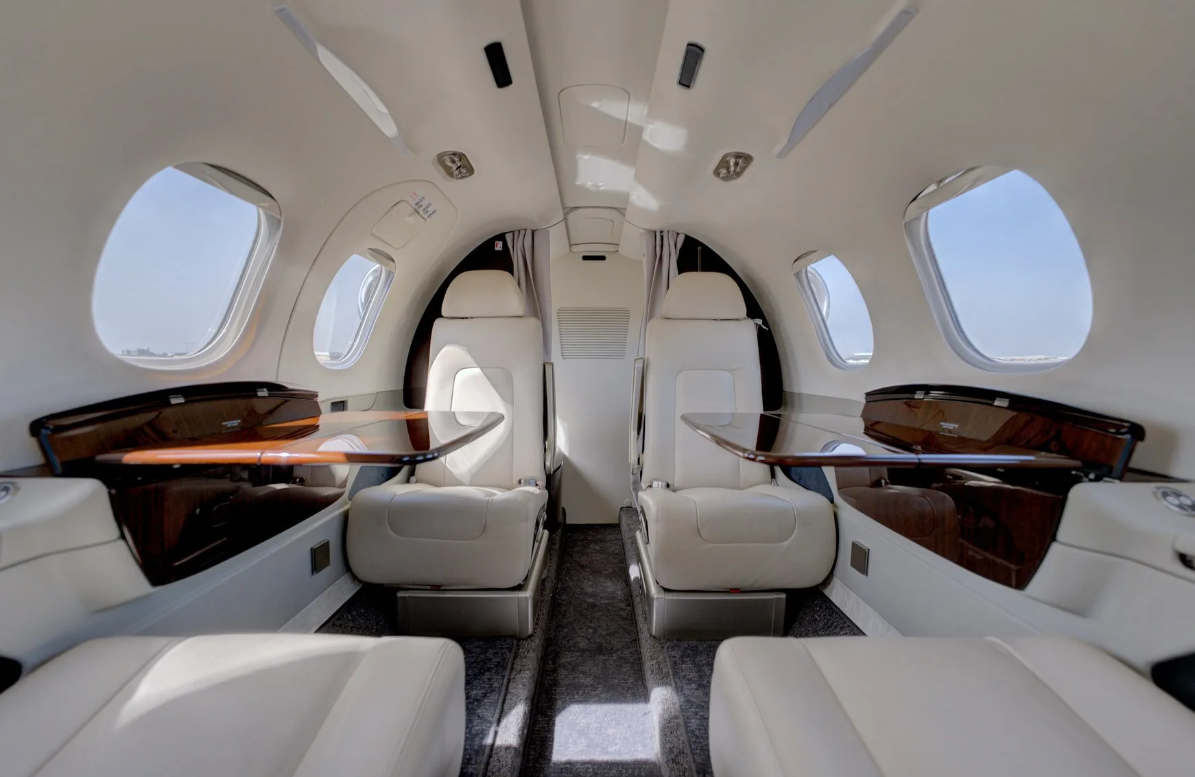 Cabin interior of a 2023 Embraer PHENOM 100EV | Leviate Air Group.