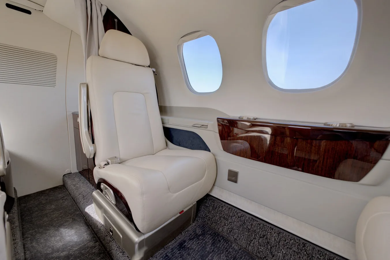 Cabin interior of a 2023 Embraer PHENOM 100EV | Leviate Air Group.