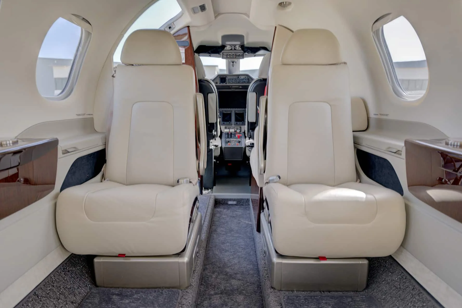 Cabin interior of a 2023 Embraer PHENOM 100EV | Leviate Air Group.