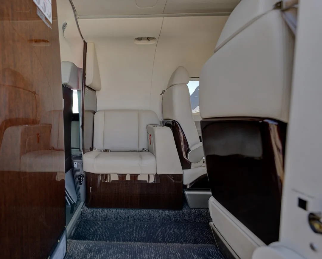 Cabin interior of a 2023 Embraer PHENOM 100EV | Leviate Air Group.