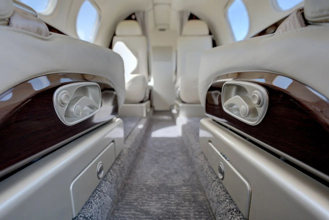 Cabin interior of a 2023 Embraer PHENOM 100EV | Leviate Air Group.