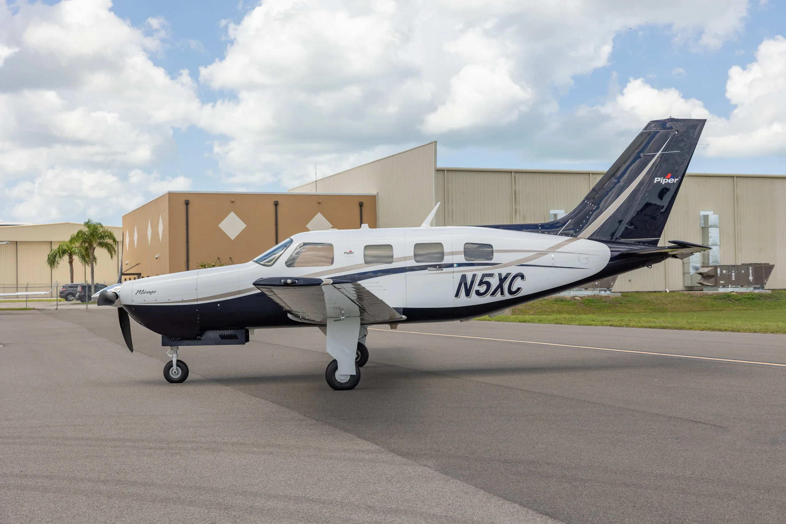 Exterior view of a 2012 Piper Mirage, N5XC.
