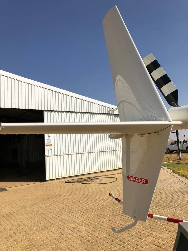 Exterior view of a 2015 Robinson R44 Raven II, ZS-HYR.