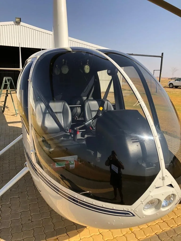 Exterior view of a 2015 Robinson R44 Raven II, ZS-HYR.