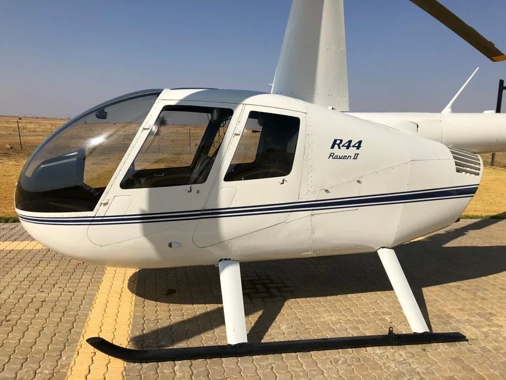 Exterior view of a 2015 Robinson R44 Raven II, ZS-HYR.