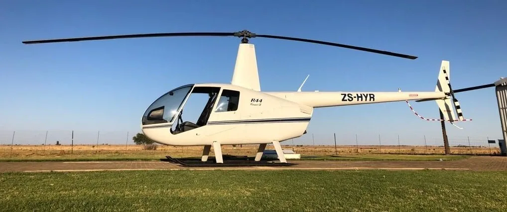 Exterior view of a 2015 Robinson R44 Raven II, ZS-HYR.