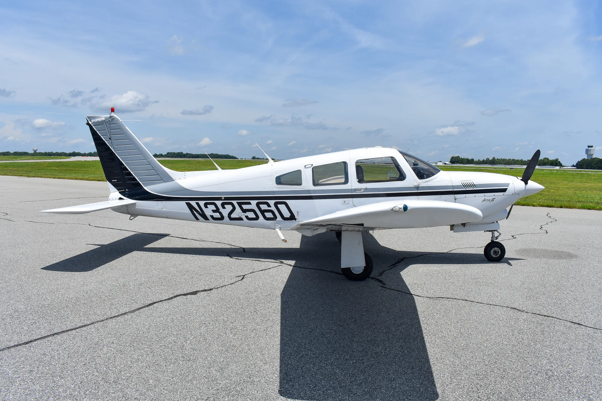 Exterior view of a 1977 Piper Turbo Arrow, N3256Q.
