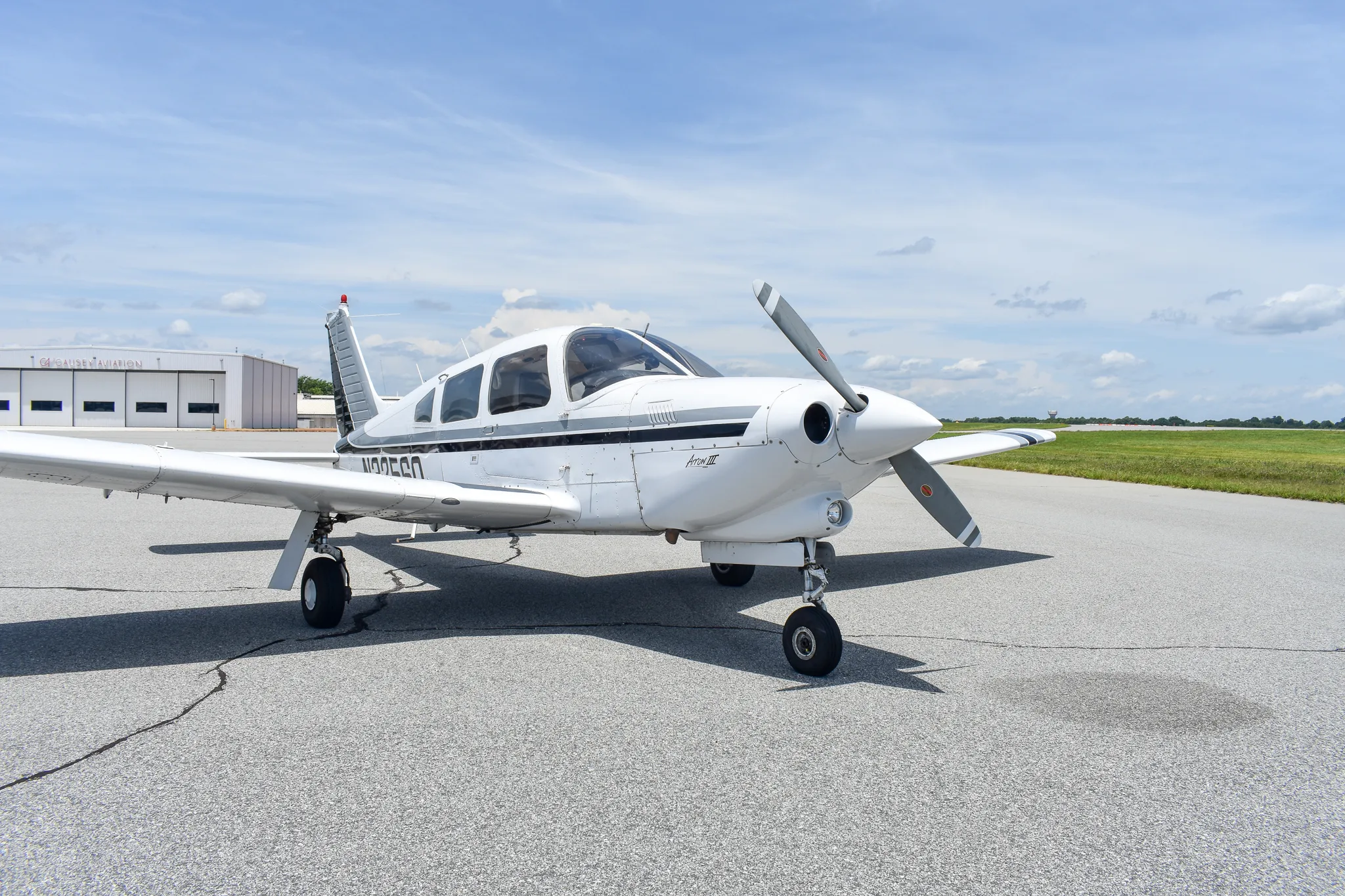 Exterior view of a 1977 Piper Turbo Arrow, N3256Q.