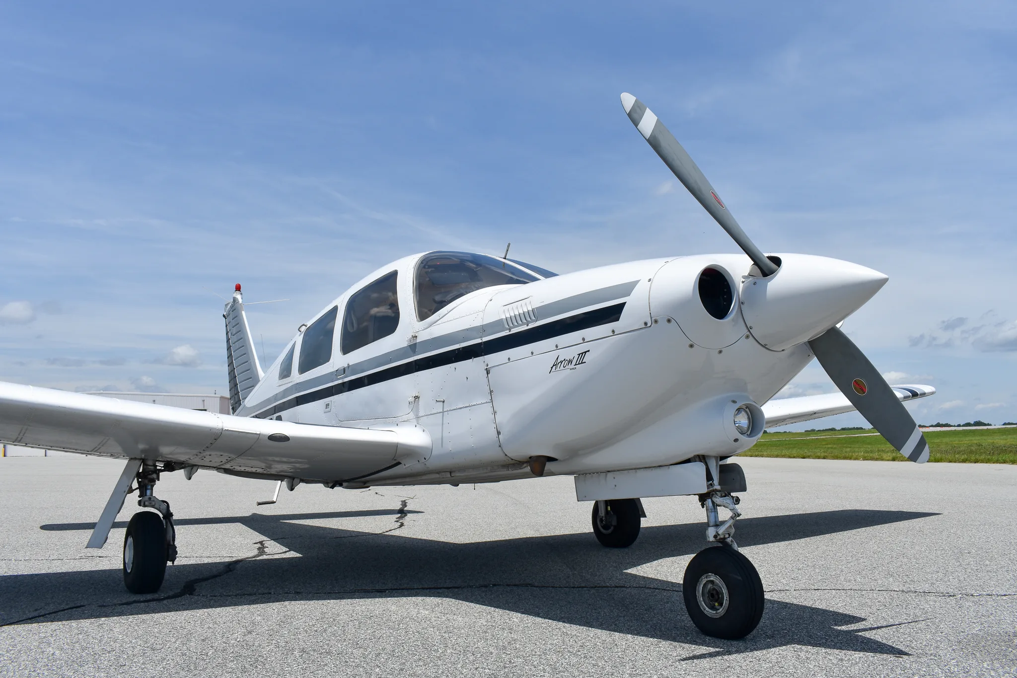 Exterior view of a 1977 Piper Turbo Arrow, N3256Q.