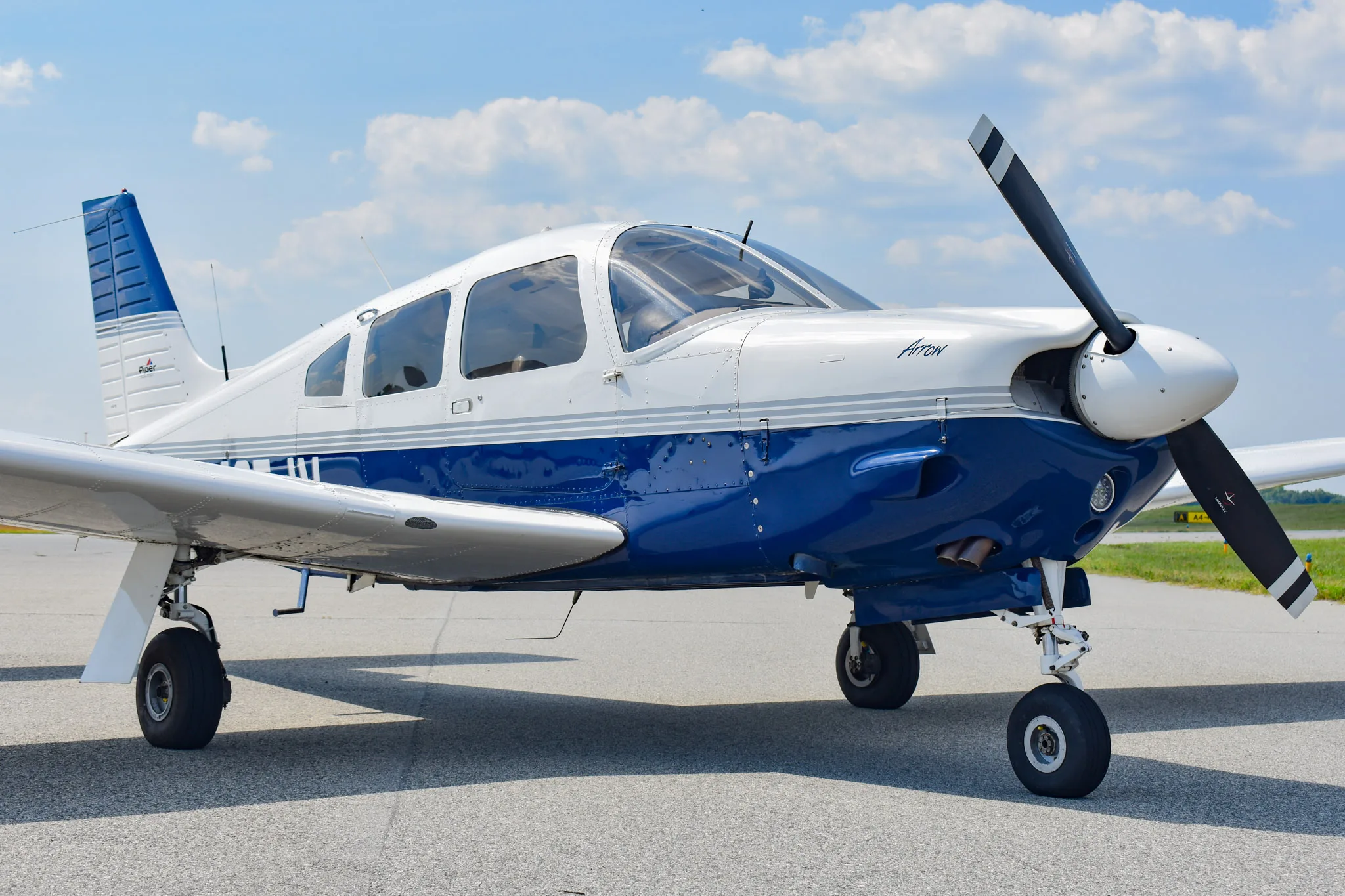 Exterior view of a 2004 Piper Arrow 201, N425JV.