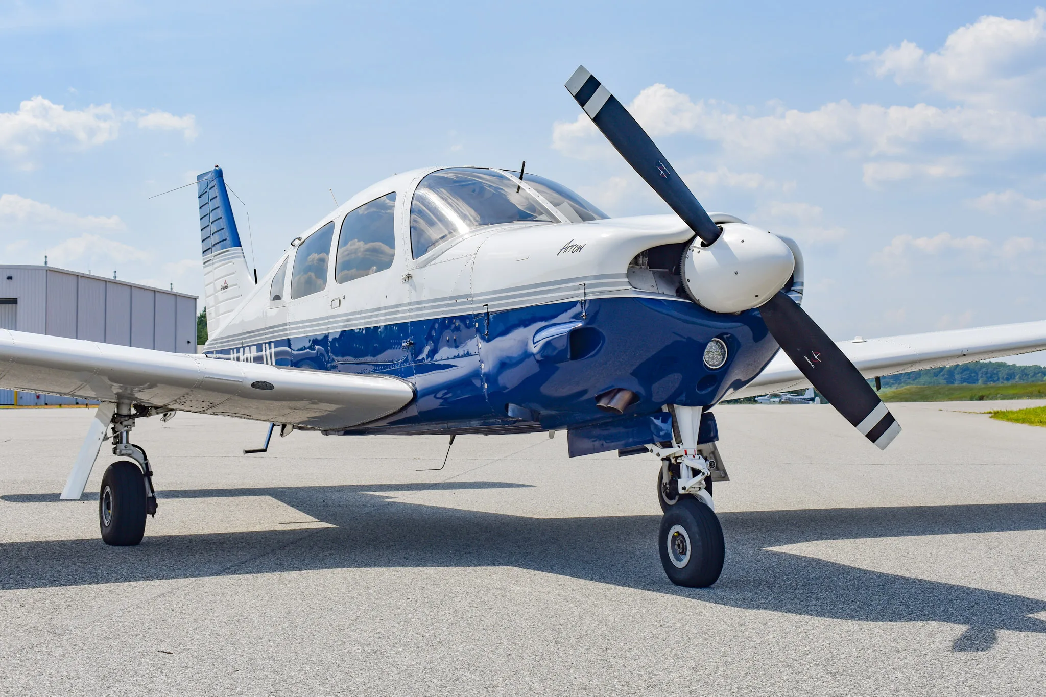 Exterior view of a 2004 Piper Arrow 201, N425JV.