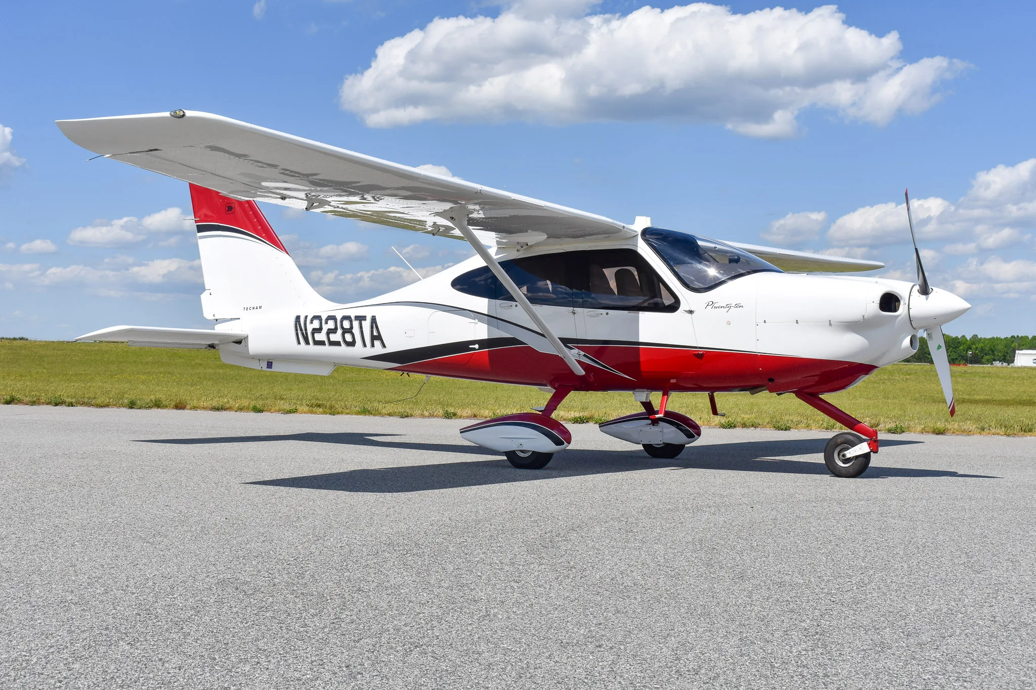 Exterior view of a 2016 Tecnam P2010, N228TA.