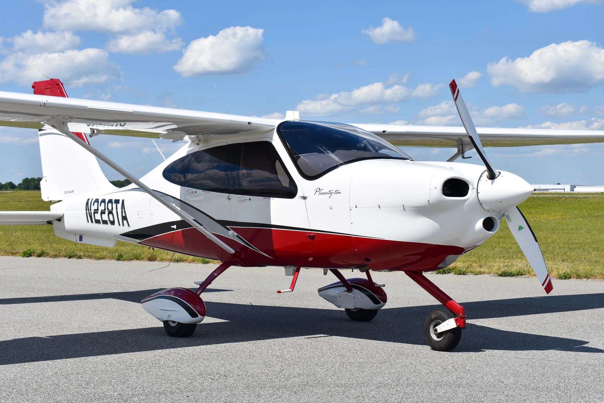 Exterior view of a 2016 Tecnam P2010, N228TA.