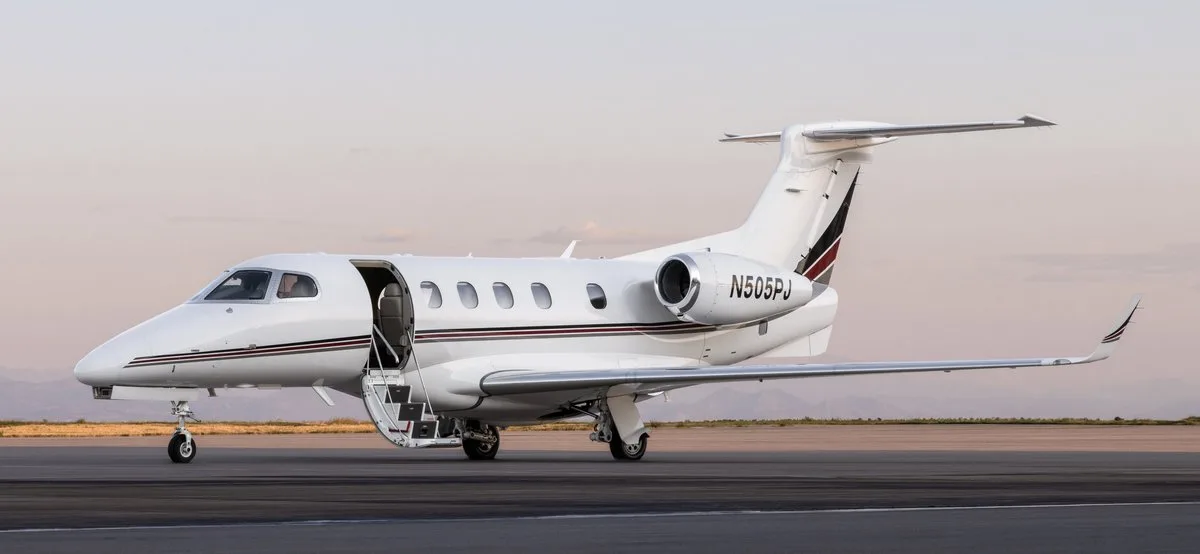 Exterior view of a 2013 Embraer Phenom 300 SN 50500165, N505PJ.