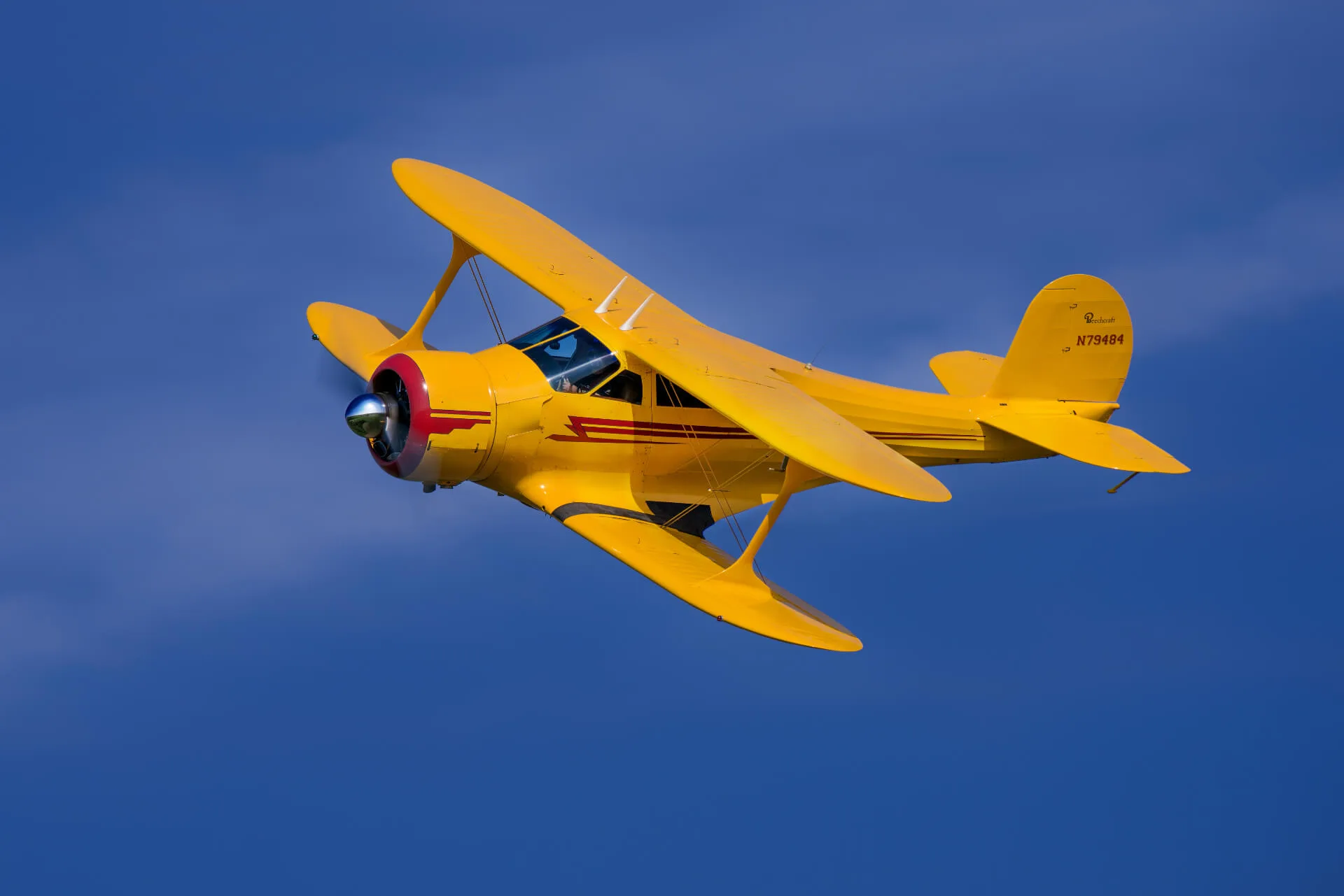Marketing image of a 1943 Beechcraft D-17S Staggerwing.