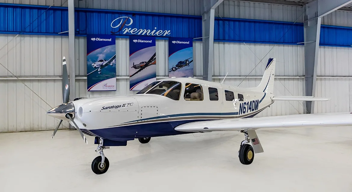 Exterior view of a 2006 Piper Saratoga II TC, N614DM.