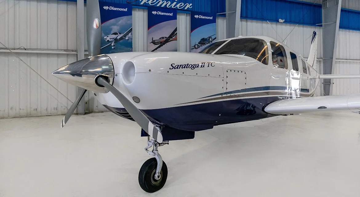 Exterior view of a 2006 Piper Saratoga II TC, N614DM.