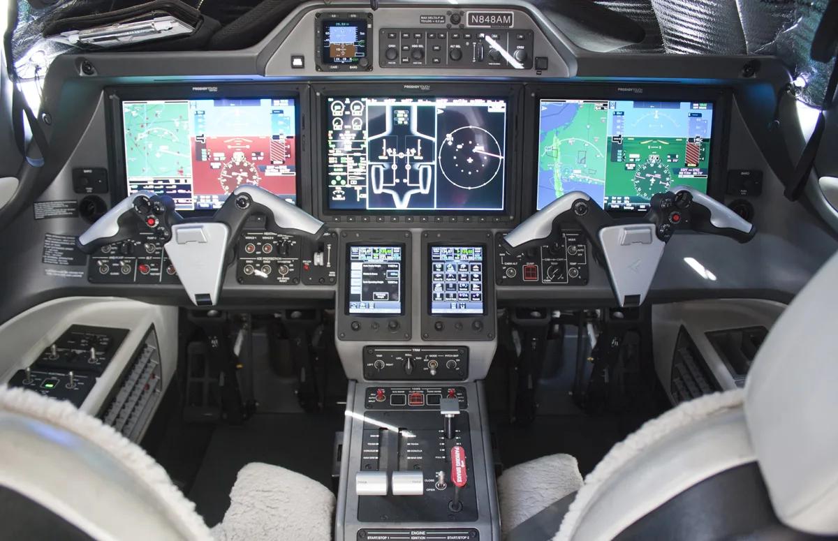Cockpit and instrument panel of a 2015 Embraer phenom 300.