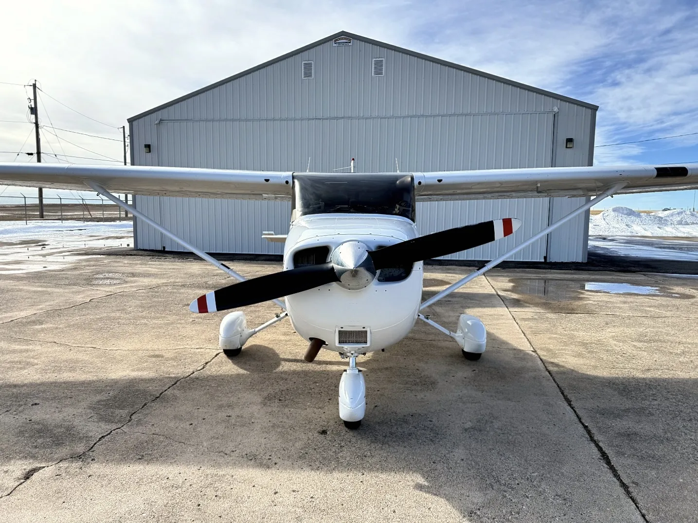 Exterior view of a 2001 Cessna 172R, N64JA.