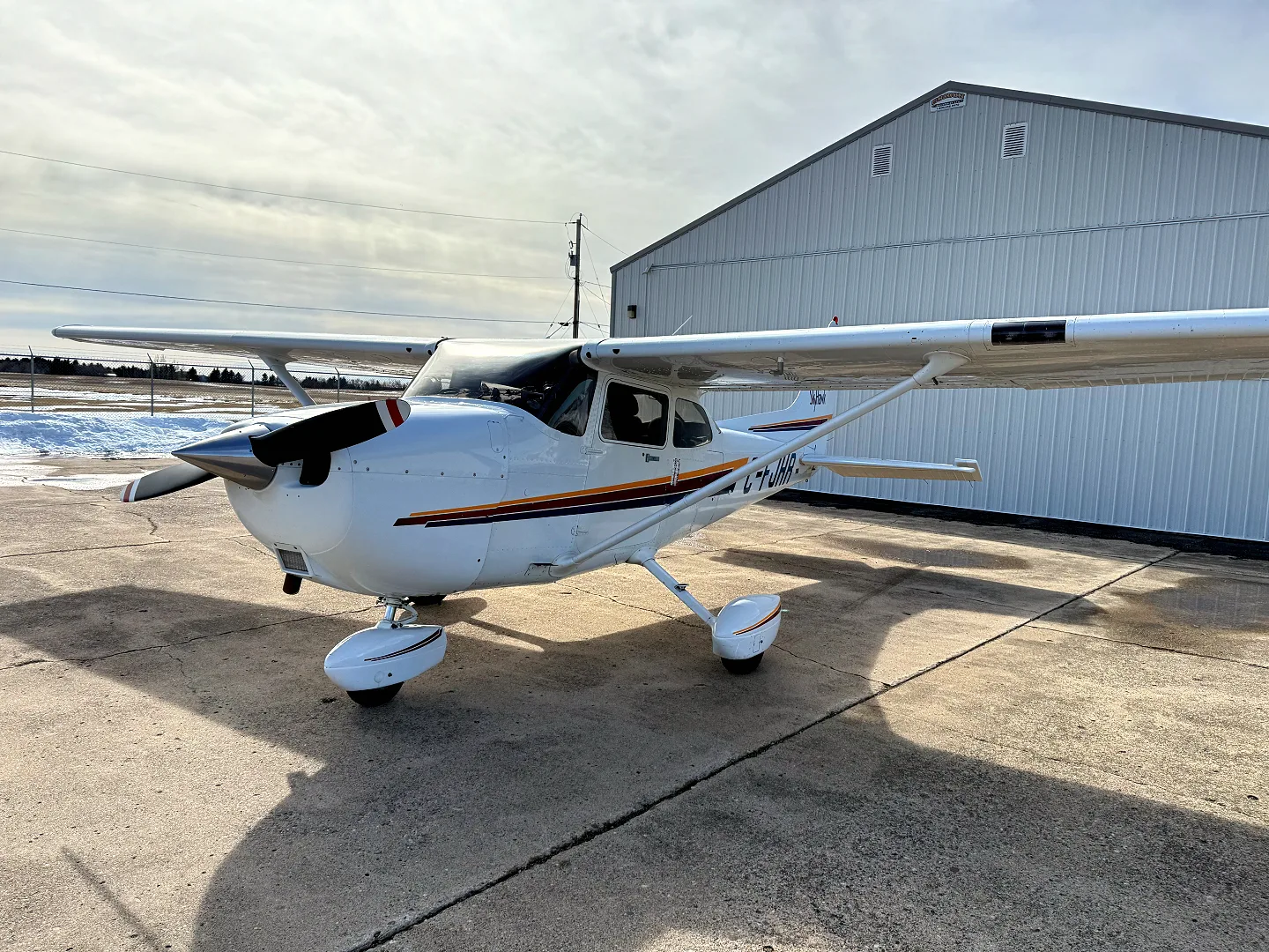 Exterior view of a 2001 Cessna 172R, N64JA.