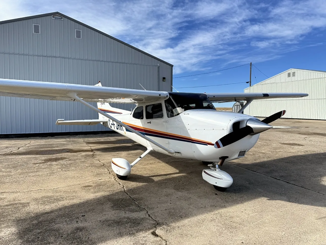 Exterior view of a 2001 Cessna 172R, N64JA.