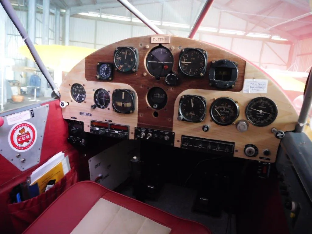 Cockpit and instrument panel of a Piper PA12 Super Cruiser.