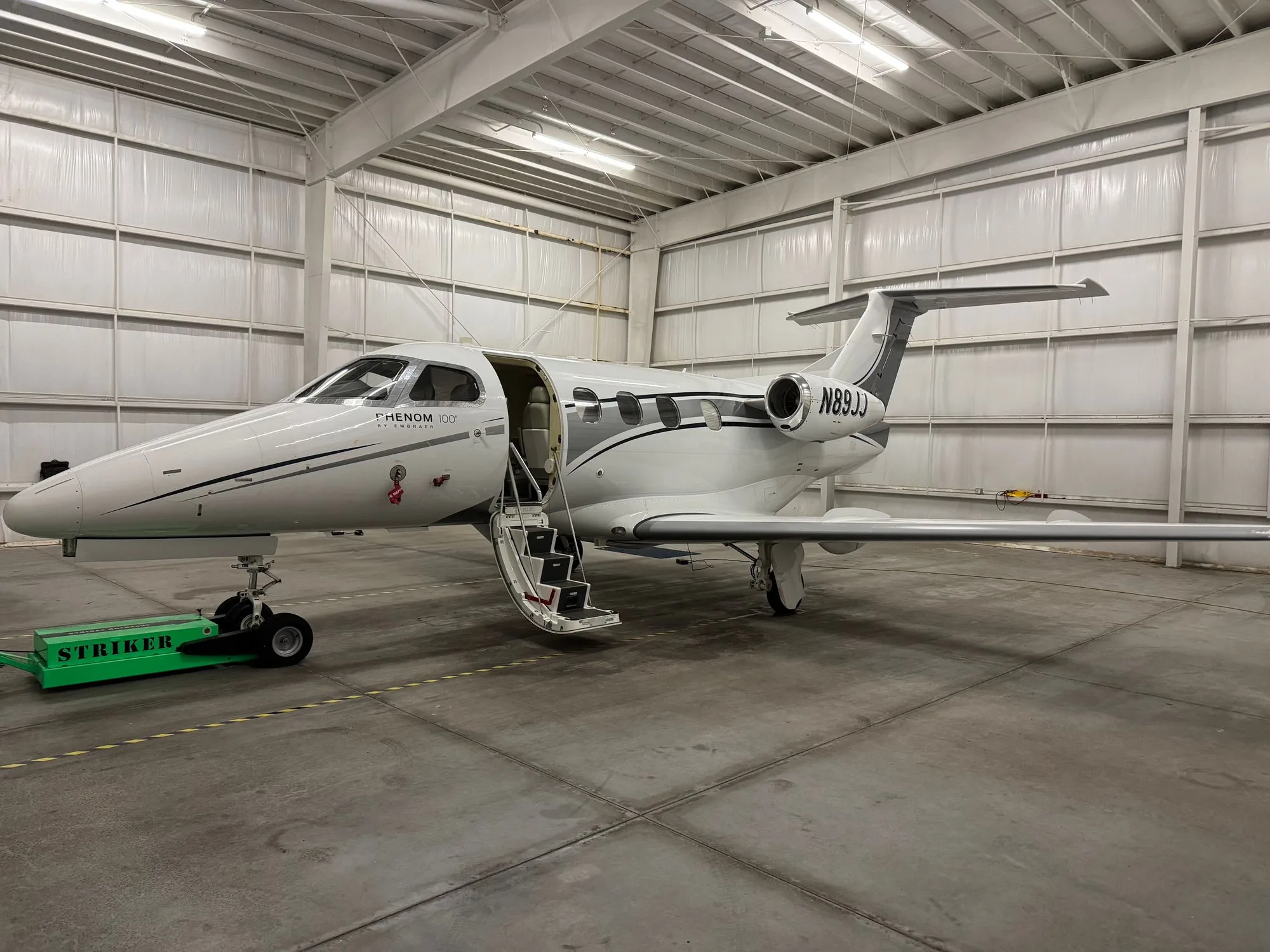 Exterior view of a 2010 Embraer Phenom 100.
