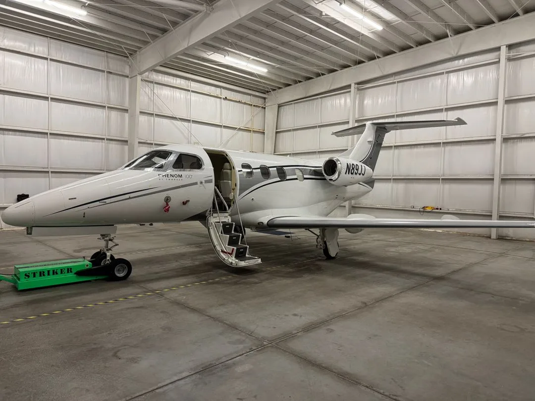Exterior view of a 2010 Embraer Phenom 100.
